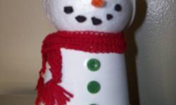Hand-made snowmen.  Everyone is different...no two the same.  The scarves were hand-crocheted. The hats sewn on my own sewing machine.  Asking $10 each. They can be personalized at no additional cost...so if you would like a name or the year put on them,