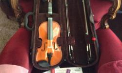 Comes with case and strap, two bows, rosin (2), shoulder brace, some extra strings, and grades 1-3 books (includes cds). Almost new, perfect condition, about 50 hours playing time on it in total. My daughter's principal instrument is piano and now that
