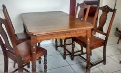 This is a very nice hardwood table with four chairs. 1950's era. The table is 45" x 32" and extends to 59" with two leaves, 31" high. I don't think the chairs are hardwood. The seats are leather covered. The chairs show some sign of wear and tear but