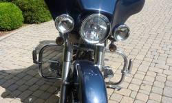 Here is a great Customized Street Glide with over $3000 in Accessories & options, Rinehart Exhaust, French Ringed Headlight, with running lights. Passenger backrest mounting
hardware with removable backrest. Custom luggage rack. Lots of chrome on the