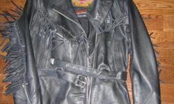 Ladies Harley Davidson motorcycle jacket and chaps.
Chaps are by Bristol and made in Montreal. Jacket is medium and the chaps are small. The jacket has fringes, zippers, belts, conches, and is totally decked out. It is heavy duty and been used very