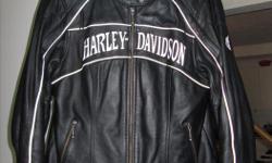 Genuine Harley Davidson woman's leather jacket size large.
Two way zippers on sleeves and mane zipper.
Metal tassels on mane zipper and front pocket zippers.
Lots of venting on this jacket.