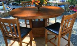 High Dining Table + 4 Chairs, dark coloured wood
In VERY GOOD CONDITION.