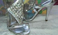 Silver & rhinestones embellished. very dressy. size 9. worn 2x. feminine & comfortable.