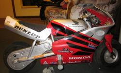 Honda Mini bike (pocket bike). comes with spare battery ($50 value)
comes with charger aswell.
Its electric! 150 watts motor. 18 Volt. Its very quiet. goes around 20km/hour.
has an aftermarket headlight. (for night riding)
good brakes.
its too small for
