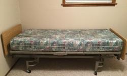 Electric hospital bed. Total bed length 86.5" width 39". Custom foam mattress length 80" width 39". Very comfortable. Comes with detachable full length bed rails and padded covers.
