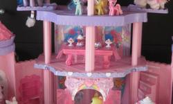 27 my little ponies + 11 other ponies
Castle that is FULLY intact with Magical Wand
Bed with blanket,pillow & night mask for pony. Bed also has a drawer that opens
Table that middle flips around for a whole new meal :) has 7 dishes of food
Air Balloon
