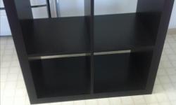 Ikea black/brown Kallax 4 cubby shelf. Has some scratches, overall good condition.
Measures about 31" x 31"