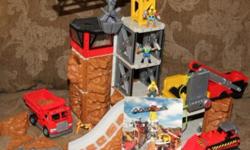 This is a great set that allows you to build different variations of a crane rock quarry. Instructions included.
The crane is battery operated as well as a working conveyor belt for rocks to fall through into the dump truck.
We also have a fire hall set