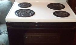 30" 4 elements electric stove. With timer, clock, light. Works Great. Good Seals, Everything works.