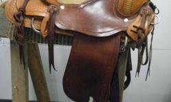 Very lightly used western saddle, 16" seat
very showy
mixed brown colours with barb wire borders,
pre-twisted fenders, cheyenne roll,
$3,900 new
http://www.jmcustomsaddles.com/Roper.html