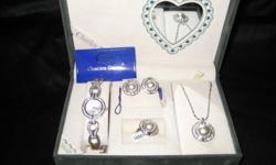 Great Christmas Gift!
New - Has never been worn, all tags still on or in box.
All matching - Watch, Ring, Necklace (approx.18") & Earrings
