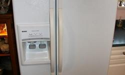 This is a Side by Side Refrigerator in good working condition.