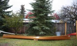 Seda Kevlar Ultralight Canoe. 18'6" length. Beautiful wood trim, gunnels, yoke, wood/cane seats.  Ultralight racing model.  No gel coat paint, just the natural beauty and lightness of clear kevlar.  Very stable and very fast canoe.  Amazing tracking