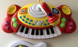 $10 Keyboard with microphone; lots of functions along with volume buttons. Has working batteries
$5 Elmo guitar toy. Has working batteries