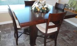 Kitchen or Dinning table with 5 chairs. Microfiber seat cover. Mahagauny color. Brand new $2500, asking $500obo. Table is 54inches x54inches 3ft tall. including an 18inch removable insert.
Has slight wear and tear (as shown) but over all great condition.