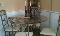Glass kitchen table and four chairs. Excellent condition