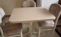 Smaller kitchen table and 3 chairs  30" x 36".  Excellent condition.