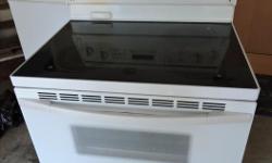 Standard size white KitchenAid glass top stove. Very good condition and everything is working perfectly.