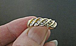 Ladies diamond band.  Size 7.  10k yellow gold, 2.3g.  15 diamonds, approx. .35ctw.