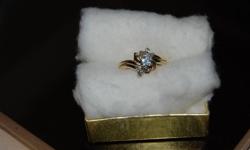 Ring currently appraised at $2670.00.
 
Appraisal report completed Aug.12/11 is as follows:
One Ladies Diamond Engagment ring.  This ring is fashioned in yellow and white gold which is stamped 14K.  It is an off set design which is accented by one round