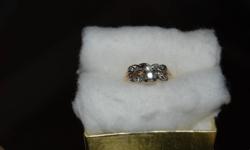 Ring currently appraised at $1670.00.
 
Appraisal report completed Aug.12/11 is as follows:
One Ladies Diamond Engagment ring.  This ring is fashioned in yellow and white gold which is stamped 14K 18K.  It is a traditional design which is accented by one