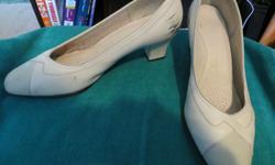 For sale are two pair of leather dress shoes that were worn for work (retail). Both have a thick heel approx. 2" high. I believe they are both size 9 (sizes are worn off).
Beige - Design on front, not plain. Scuffed on one side of shoe (inside part) -