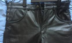 From Weavers, worn once, Ladies leather motorcycle pants. Outside of legs has zipper and bottom portion has snaps. Long but can be cut to suit rider. Size 30 or approximate ladies 4-8. Paid $230 plus tax.