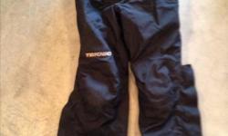 Ladies Teknic waterproof pants, Size 12. Knee & hip pads, removable thermal liner & suspenders. In very good condition