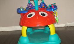 This exersaucer is shaped and looks like a ladybug. It bounces, and has lots of toys attached. You can attach more toys if you choose to. From a smoke-free home.