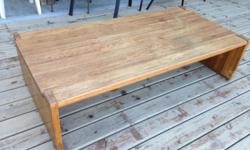 Honey color coffee table with solid gable ends - modern design. Real red oak approx 1 1/4 inch thick - solid. Would look fantastic with a stain or glazed finish. Measures 60" x 36".
