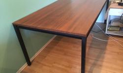 Large, multi-utility, solid wood and steel table. Measurements are:
6'5" L x 3'1" W x 2"6'H