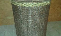 Nice woven rattan Laundry Hamper and Lid, with cotton washable liner. Medium brown tone, wooden accent handle on lid. New and never used.