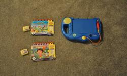 Like new condition
Blue in color
Comes with Dora To the Rescue and Flops Big Day books and cartridges, both in FRENCH.
Item located in Elkford, BC. 
Delivery to Lethbridge can be arranged on December 15th.
Item comes a smoke free and pet free home.
Check