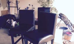 Three black leather chairs. Counter top height. good condition. 100 OBO