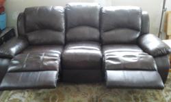 Leather couch with 2 built-in recliners. Purchased new. Change of plans.