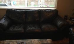 Brown leather sofa, loveseat, and chair. Real leather with vinyl backing, in good condition with no rips or tears, smoke free home.