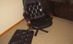 Very comfortable. Locks in semi-reclining position. Comes with leather ottoman. Great condition - no holes in the leather anywhere. One button missing on the ottoman.  Great price for this set.