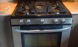 30" slide in gas range. 5 burners including super power, power and simmer burners. Self cleaning oven great condition, 5 years old