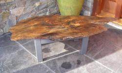 live edge coffee table. measures 24 d x 50 l x 14 h. stunning west coast character piece.