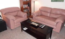 This lovely dusty rose, genuine leather set is an excellent quality soft leather made by Paliser.  It is very comfortable to snuggle up in and will fit in with any decor.   It is in excellent shape and very easy to clean with just a wipe. We moved into a