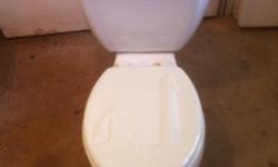 Kohler White low flush toilet with seat included in great condition. 6 litres per flush.