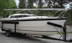 2000 26X fresh water use only.  70 hp Evinrude EFI four stroke.  Nice boat in great shape with many extras: CDI roller furling, jenniker sail, sail covers, depth/fish finder, cockpit table, SS BBQ, cockpit biminy, two batteries, anchor and chain with