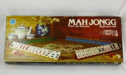 Mah Jongg Beginner?s Set Milton Bradley 1975 Bilingual Complete Excellent 
* Published in 1975 by Copp Clark Canada for Milton Bradley
* 160 Tiles, 4 Racks, Chips, Dice, Scoring Guide, Instructions
* English and French Text and Instructions.
 
The Game is