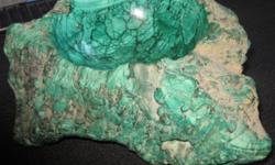 Rare find! A huge piece of Malachite (semi precious) rock. A polished dish on the top with a 6.5" (16 cm) diameter. The rock is 5" (12cm) high and approx. 12" (30 cm) across and weighs an impressive 10.7 kg ( 23.5 pounds!)
Country of origin: The Congo,
