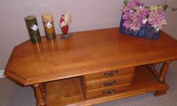 Very solid maple coffee table with bottom shelf
The 3 drawers open from the front side for extra storage.
The back drawers looks the same with handles
but they don't open. This way the table can be placed
in the middle of the room and look the same
from