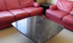 Solid Italian Marble coffee table and end table, black and grey/white marbling. Separate top and bottom peices for each. End table has on one corner peice with marble chunk missing (still have peice, easily concealed), still great tables!