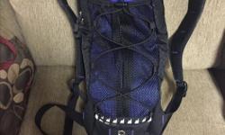 Mountain Equipement Co-op Water Backpack Carrier- comes with blatter. Light weight 15 oz.,slim line, comes with inside zipped pouch, comes with outside netted pouch 6" wide, 10" long. Great for biking also! Overall size is 18" long by 7" wide.Has shoulder