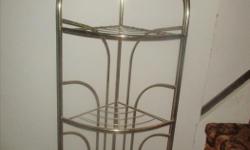 Gold colored metal plant stand, 3 shelves, triangle shape
to fit in a corner. $10.00. Call 306-543-8313