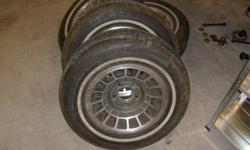 Set of 4 205/75/14 Michelin X Radial All Season tires on mag wheels. GM midsize 5 bolt car pattern. I think they were on a 70's Nova, but would probably fit other cars like camaro/firebird/malibu etc... 60% tread remaining. Asking $150, but I need these